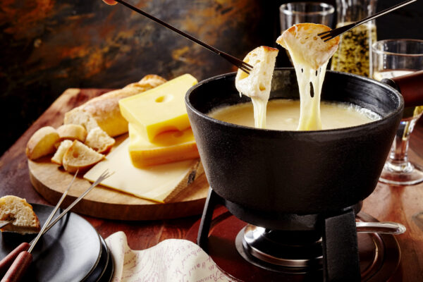 Gourmet,Swiss,Fondue,Dinner,On,A,Winter,Evening,With,Assorted